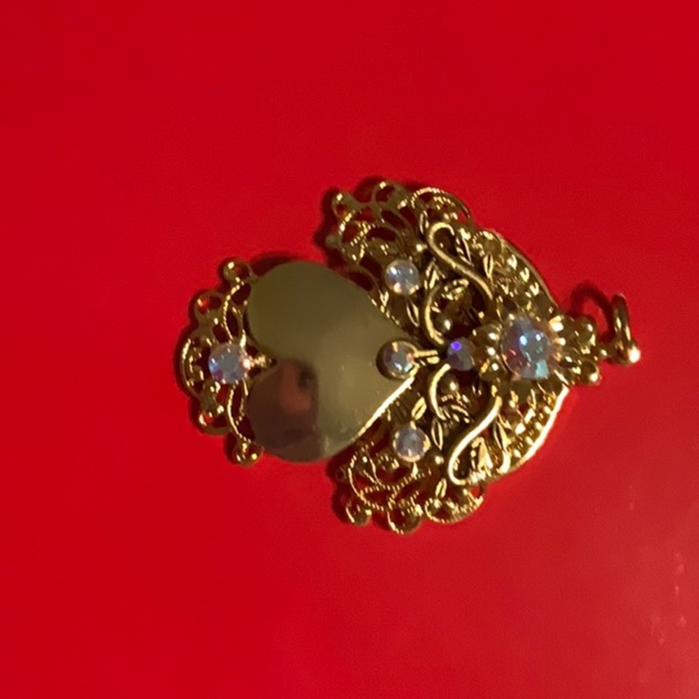 Angel with heart body pendant
